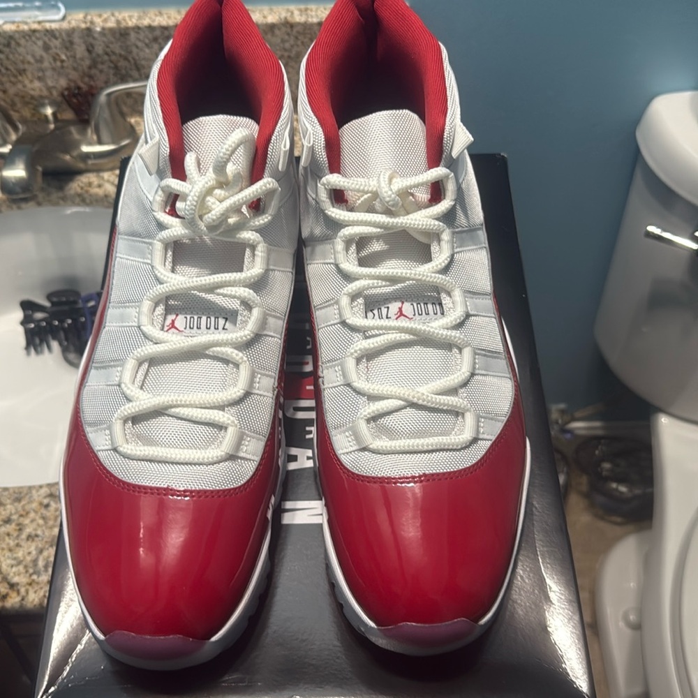 Air Jordan 11 XI Cherry white varsity red New, size 14 bought from Nike app.